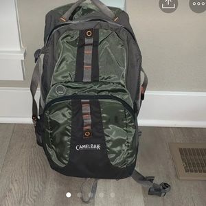 Green camelback backpack.